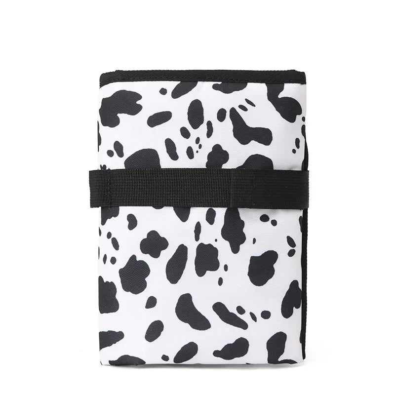 Fasciatoio portatile pieghevole impermeabile variante bianco e nero chiuso 