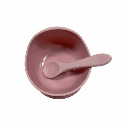 Ciotola silicone con ventosa bambini rosa su sfondo bianco